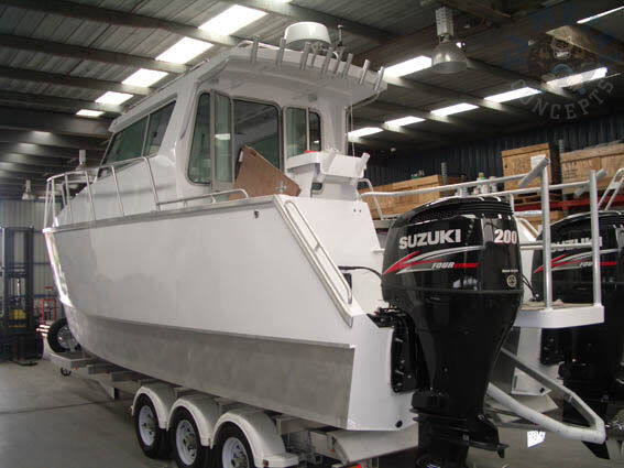 Finished cabin cruiser with twin Suzuki outboards