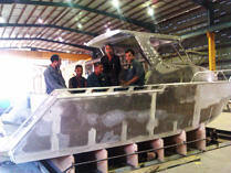 Group photo with completed boat
