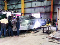 Students welding the hull