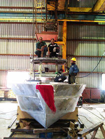 Team working on cabin with crane