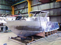 Worker on boat, side profile
