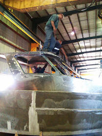 Worker on top of cabin