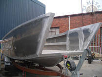 Boat hull on trailer outside