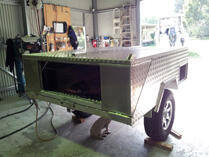 Camper trailer in workshop