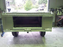 Camper rear storage compartment