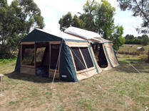 Canvas camper tent in field