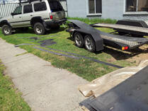 Car trailer beside 4WD