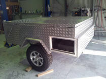 Camper with storage window