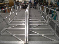 Metal gangway with handrails