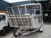 Landing craft with fold-down ramp