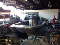 Large boat hull in workshop