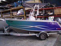 Painted fishing boat on trailer