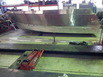 Workboat hull on floor